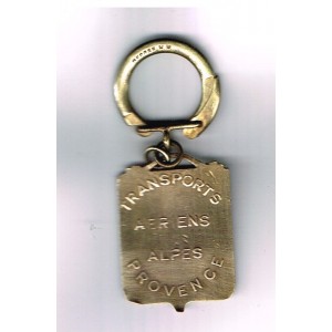 PORTE CLES TRANSPORTS AERIENS ALPES PROVENCE - METAL EMAILLE﻿ M M.